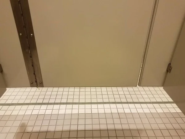 Grey Bathroom Stall Door White Tiles Floor — Stock Photo, Image