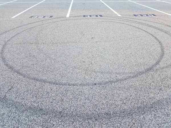 spiral or circle skid marks in parking lot