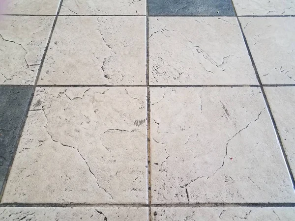 Dirty white and black floor tiles or ground — Stock Photo, Image