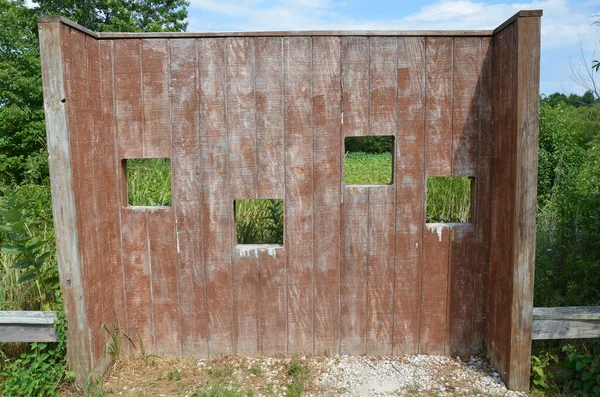 Wood animal blind with square holes or windows — Stock Photo, Image