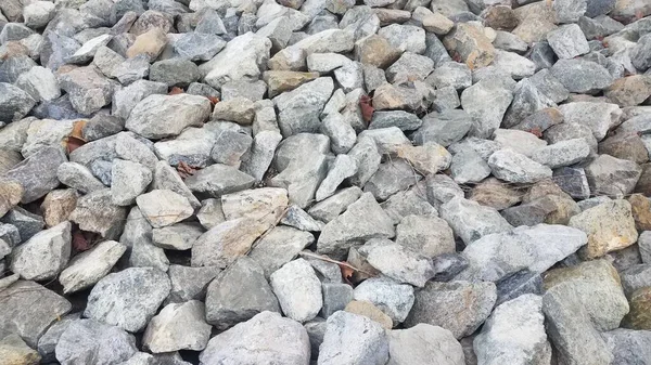 Rochas cinzentas ou pedras ou pedregulhos ou fundo — Fotografia de Stock
