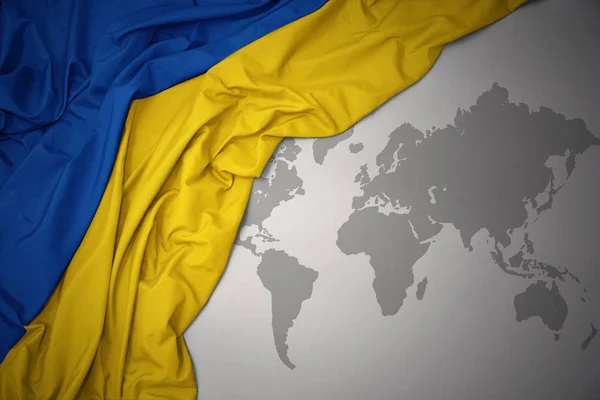 Waving Colorful National Flag Ukraine Gray World Map Background — Stock Photo, Image