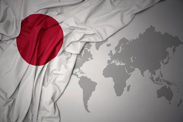 Acenando Colorido Bandeira Nacional Japão Fundo Mapa Mundo Cinza — Fotografia de Stock