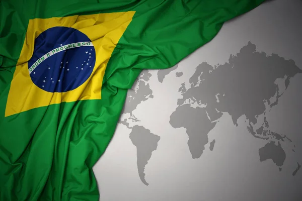 Waving Colorful National Flag Brazil Gray World Map Background — Stock Photo, Image