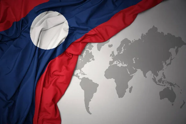 Waving Colorful National Flag Laos Gray World Map Background — Stock Photo, Image