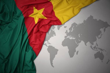 Kamerun gri dünya harita arka plan üzerinde renkli ulusal bayrak sallayarak.