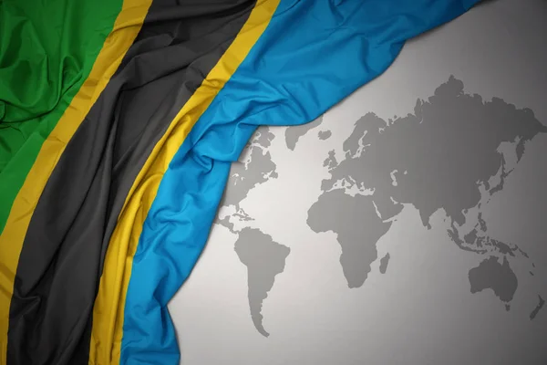 Ondeando Colorida Bandera Nacional Tanzania Sobre Fondo Gris Del Mapa —  Fotos de Stock