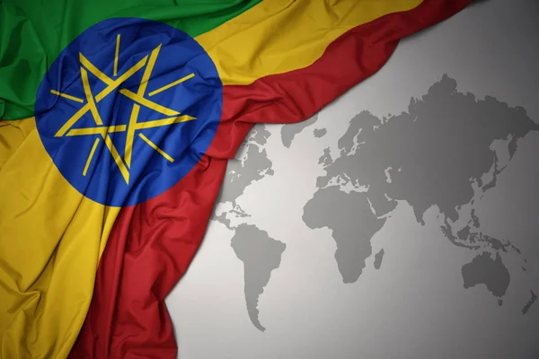 Macha Kolorowy Krajowego Flagi Etiopii Tle Szarym Świecie Mapy — Zdjęcie stockowe