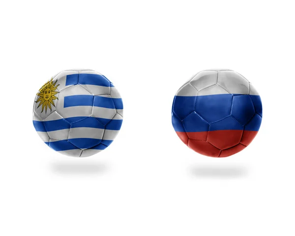 橄榄球球以乌拉圭和俄国的国旗 在白色背景上被隔离 — 图库照片