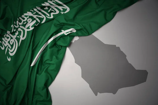 Ondeando Colorida Bandera Nacional Arabia Saudí Sobre Fondo Mapa Gris —  Fotos de Stock