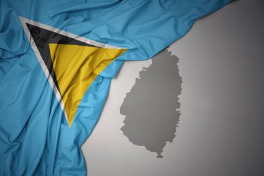 saint lucia gri harita arka plan üzerinde renkli ulusal bayrak sallayarak.