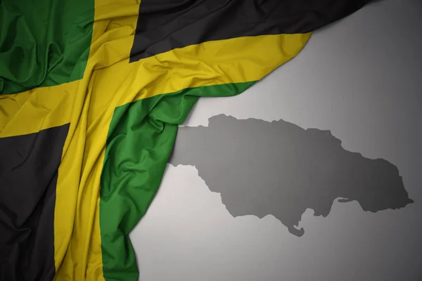 Waving Colorful National Flag Jamaica Gray Map Background — Stock Photo, Image