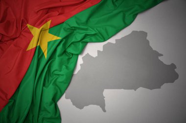 sallama renkli Ulusal bayrağını burkina Faso gri bir arka plan harita. 3D çizim