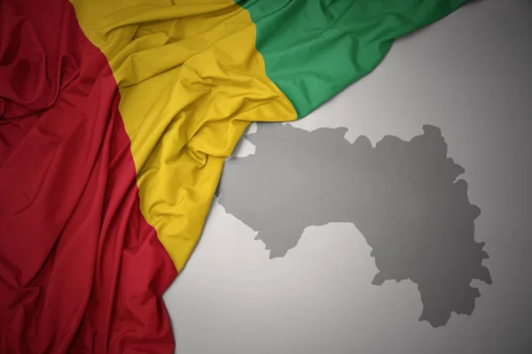 Waving Colorful National Flag Guinea Gray Map Background Illustration — Stock Photo, Image