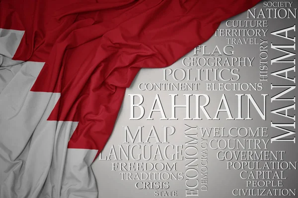 Ülke hakkında önemli kelimeler le gri bir arka plan üzerinde bahreyn renkli ulusal bayrak sallayarak — Stok fotoğraf