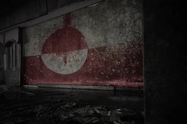 Painted flag of greenland on the dirty old wall in an abandoned ruined house. — Stock Photo, Image