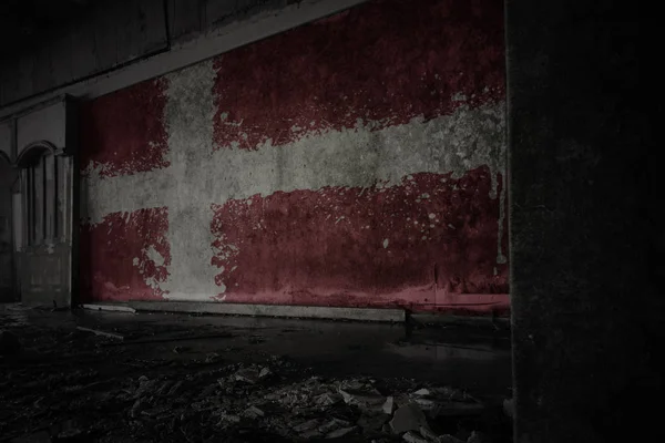 Painted flag of denmark on the dirty old wall in an abandoned ruined house. — Stock Photo, Image