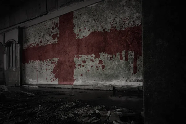 Painted flag of england on the dirty old wall in an abandoned ruined house. — Stock Photo, Image