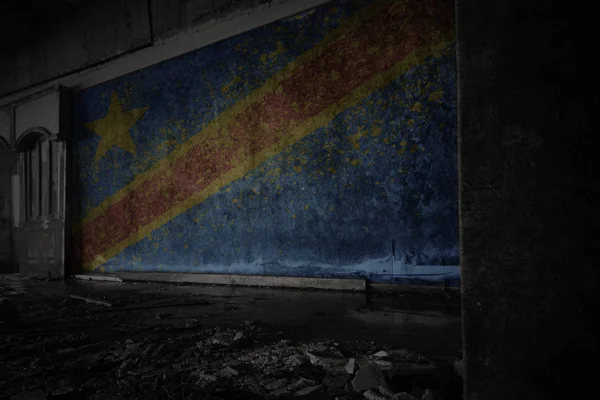 Painted flag of democratic republic of the congo on the dirty old wall in an abandoned ruined house. — Stock Photo, Image