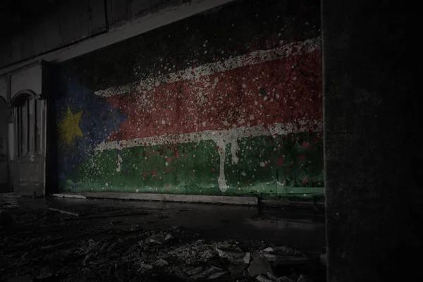 Painted flag of south sudan on the dirty old wall in an abandoned ruined house. — Stock Photo, Image