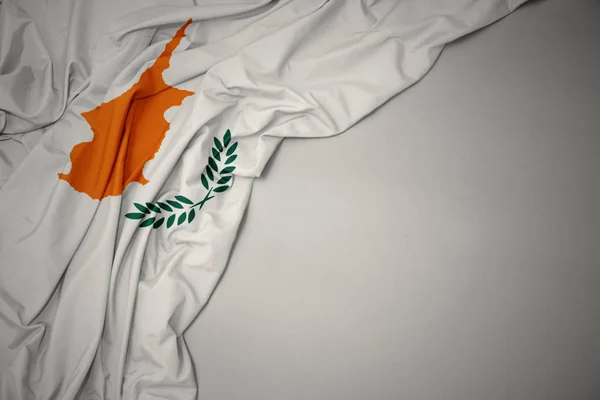 Waving national flag of cyprus on a gray background. — Stock Photo, Image