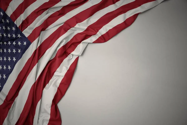 Waving national flag of united states of america on a gray background. — Stock Photo, Image