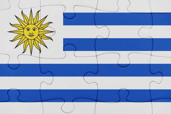 Puzzle with the national flag of uruguay. — Stock Photo, Image