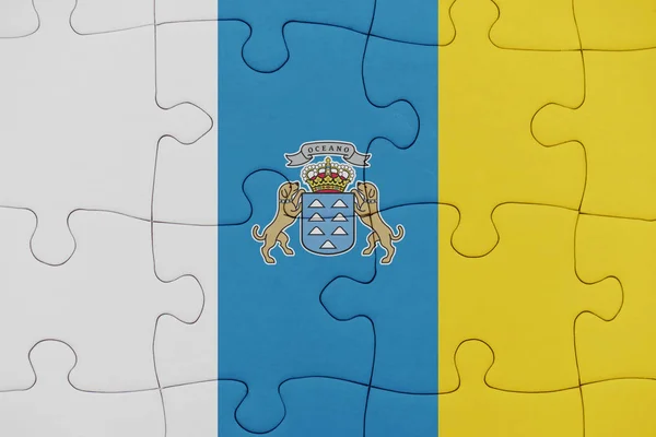 Puzzle s národní vlajka Kanárských ostrovů. — Stock fotografie