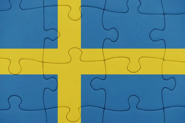 Puzzle con la bandiera nazionale dello svedese . — Foto Stock