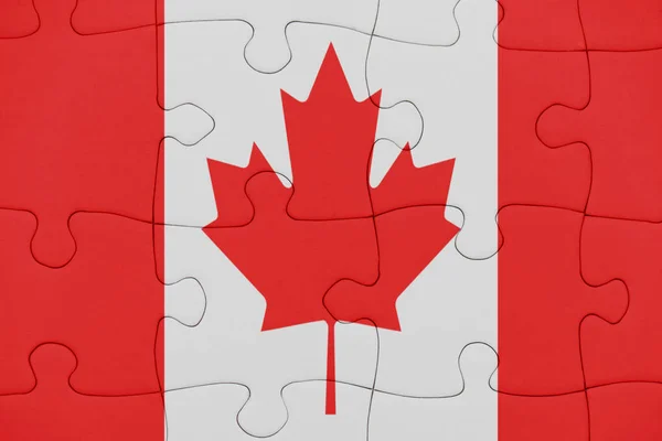 Puzzle con la bandiera nazionale del Canada . — Foto Stock