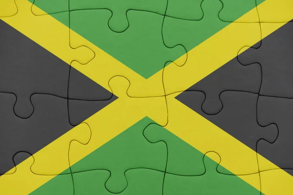 Puzzel met de nationale vlag van jamaica. — Stockfoto