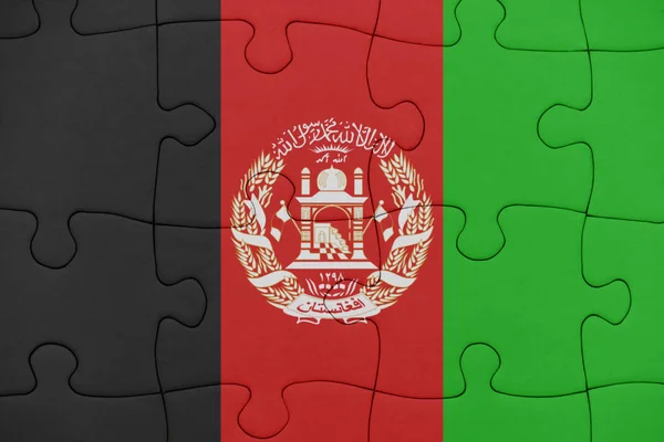 Puzzle with the national flag of afghanistan. — Stock Photo, Image