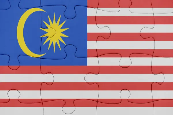 Puzzle con la bandiera nazionale della Malesia . — Foto Stock