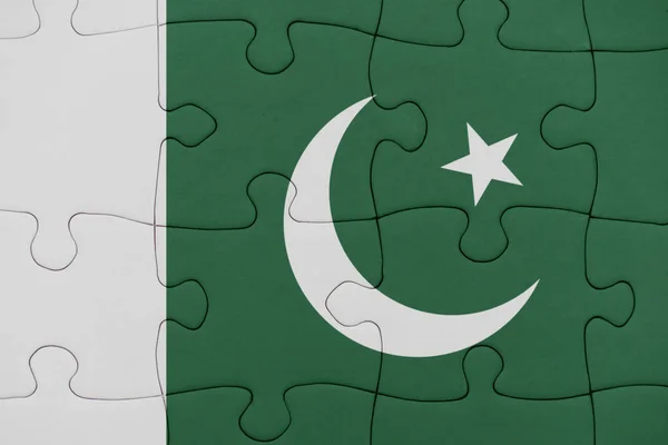 Puzzle with the national flag of pakistan. — Stock Photo, Image