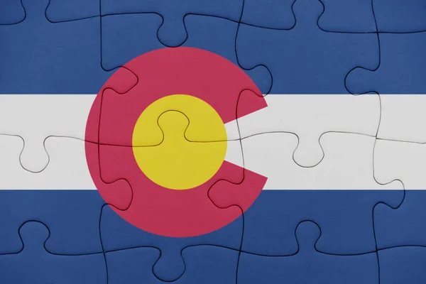 Puzzle with the flag of colorado state. — Stock Photo, Image