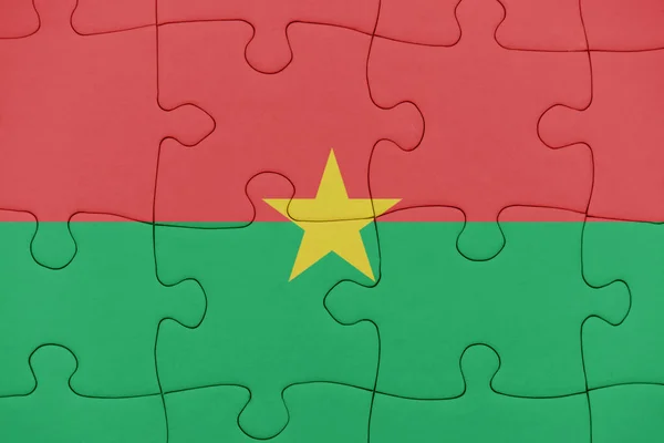 Puzzle with the national flag of burkina faso. — Stock Photo, Image