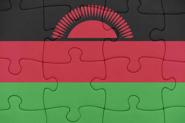 Pussel med den nationella flaggan i Malawi. — Stockfoto