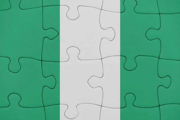 Rompecabezas con la bandera nacional de nigeria . — Foto de Stock