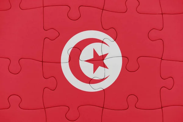 Puzzle mit der Nationalflagge Tunesiens. — Stockfoto