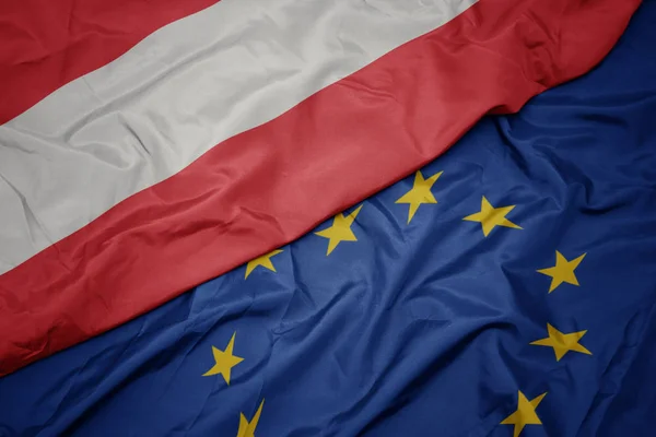 Macha kolorowy flaga Unii Europejskiej i flaga Austrii. — Zdjęcie stockowe