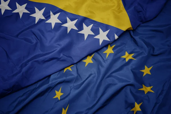 Macha kolorowy flaga Unii Europejskiej i flaga Bośni i Hercegowiny. — Zdjęcie stockowe