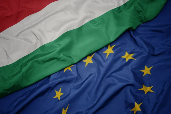 Waving colorful flag of european union and national flag of hungary. — Stock Photo, Image