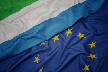 avrupa birliği ve sierra leone bayrağı renkli bayrak sallayarak.