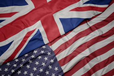 Amerika Birleşik Devletleri ve Büyük Britanya'nın ulusal bayrağı renkli bayrak sallayarak. Makro