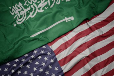 Amerika Birleşik Devletleri ve Suudi Arabistan ulusal bayrağı renkli bayrak sallayarak.