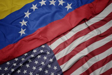 Amerika Birleşik Devletleri ve Venezuela ulusal bayrağı renkli bayrak sallayarak.