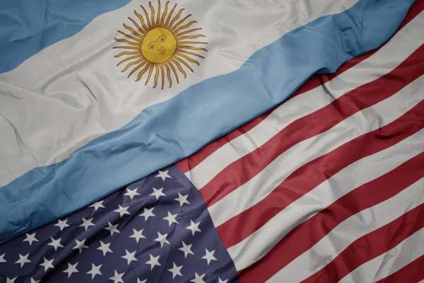 Waving colorful flag of united states of america and national flag of argentina. — Stock Photo, Image