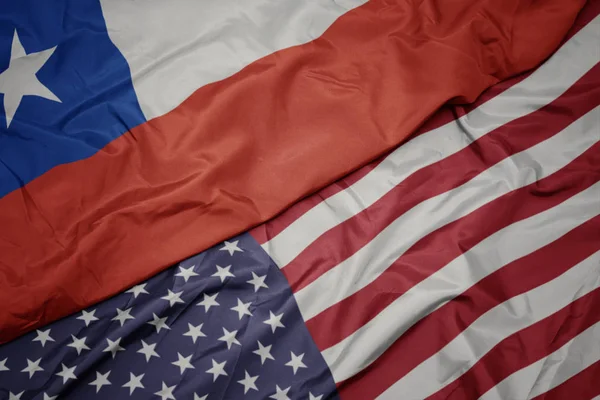 Waving colorful flag of united states of america and national flag of chile. — Stock Photo, Image