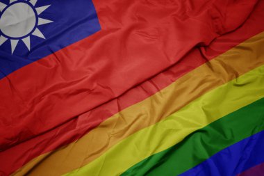 renkli gay gökkuşağı bayrağı ve tayvan ulusal bayrak sallayarak.