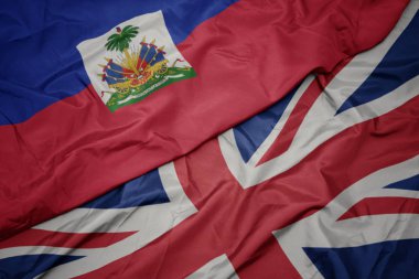 büyük Britanya ve Haiti ulusal bayrağı renkli bayrak sallayarak.